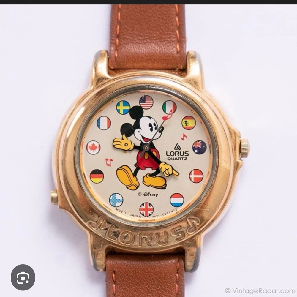 Lorus Quartz Mickey Mouse Gold-Tone Watch with its a small world musical sound